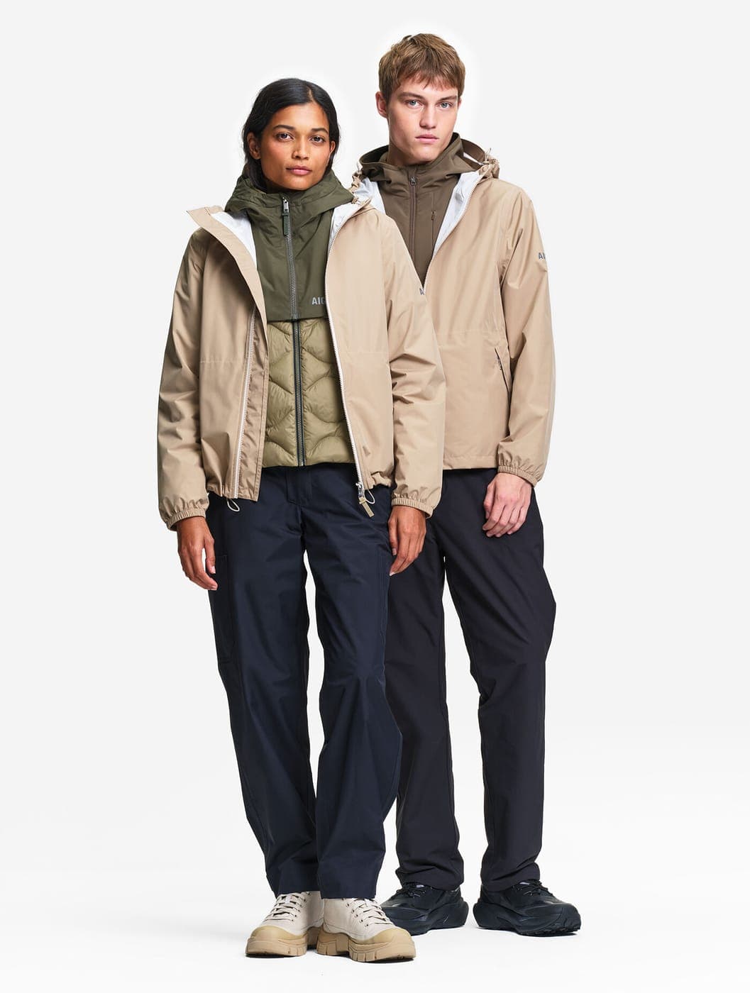 Aigle couple in waterproof jackets