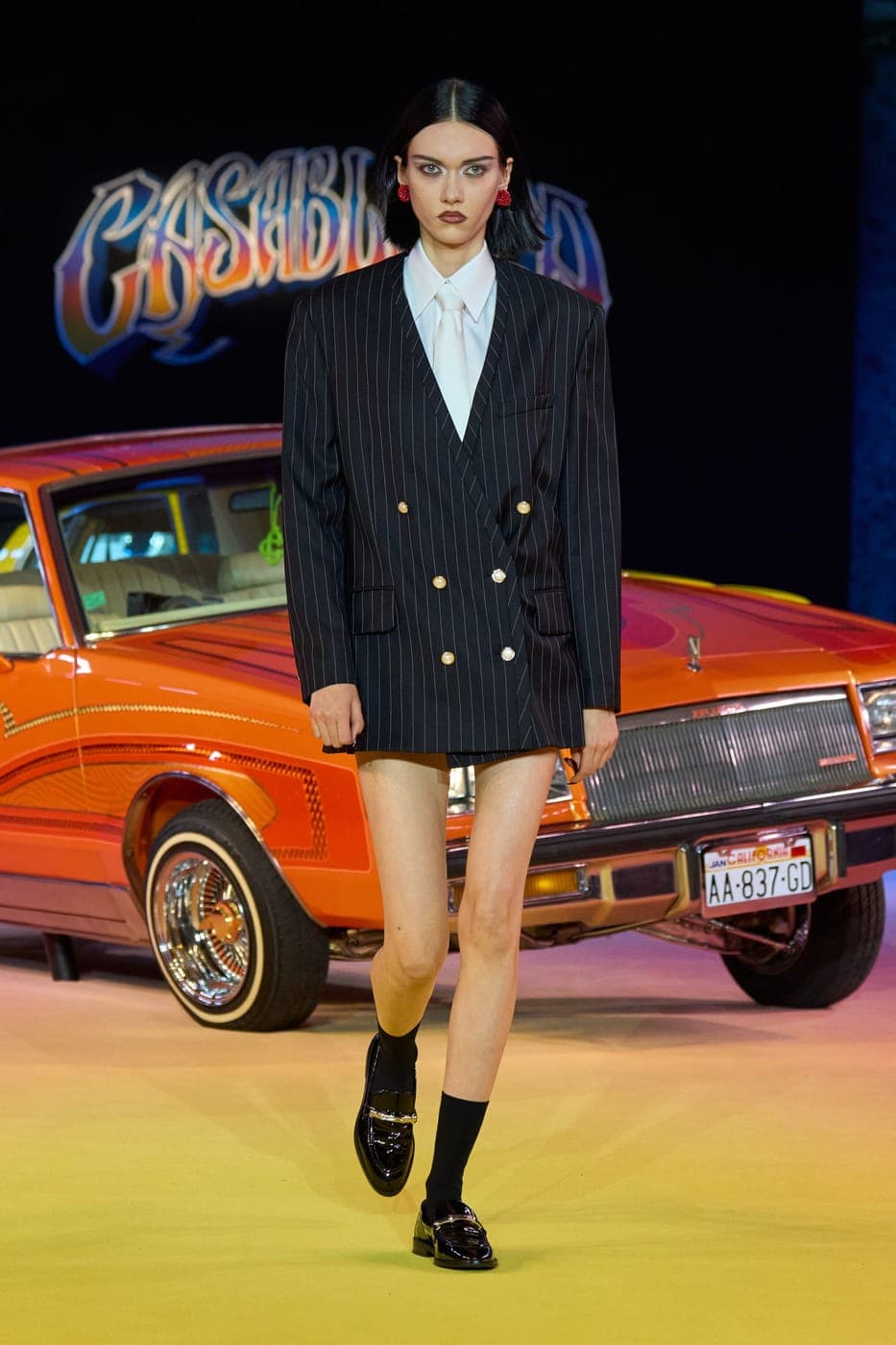 Casablanca double-breasted blazer by a vintage car